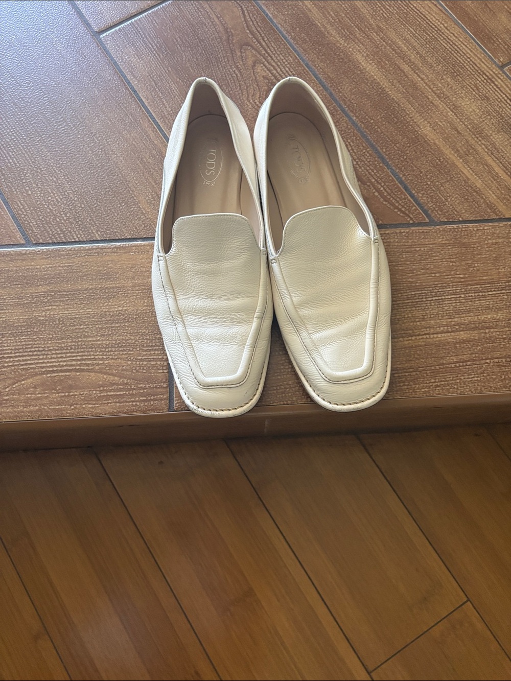 Tod's Cream Leather Penny Loafers